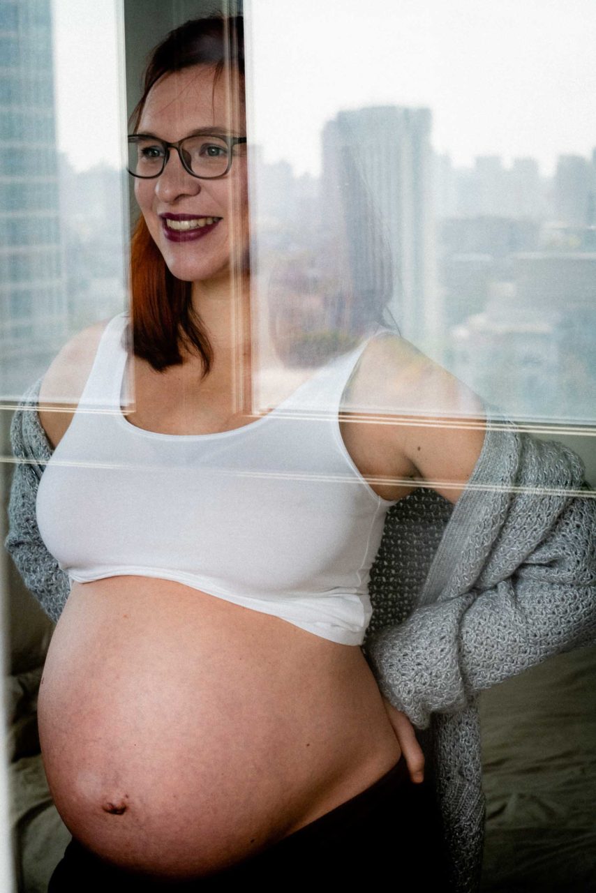 Maternity portrait by a window