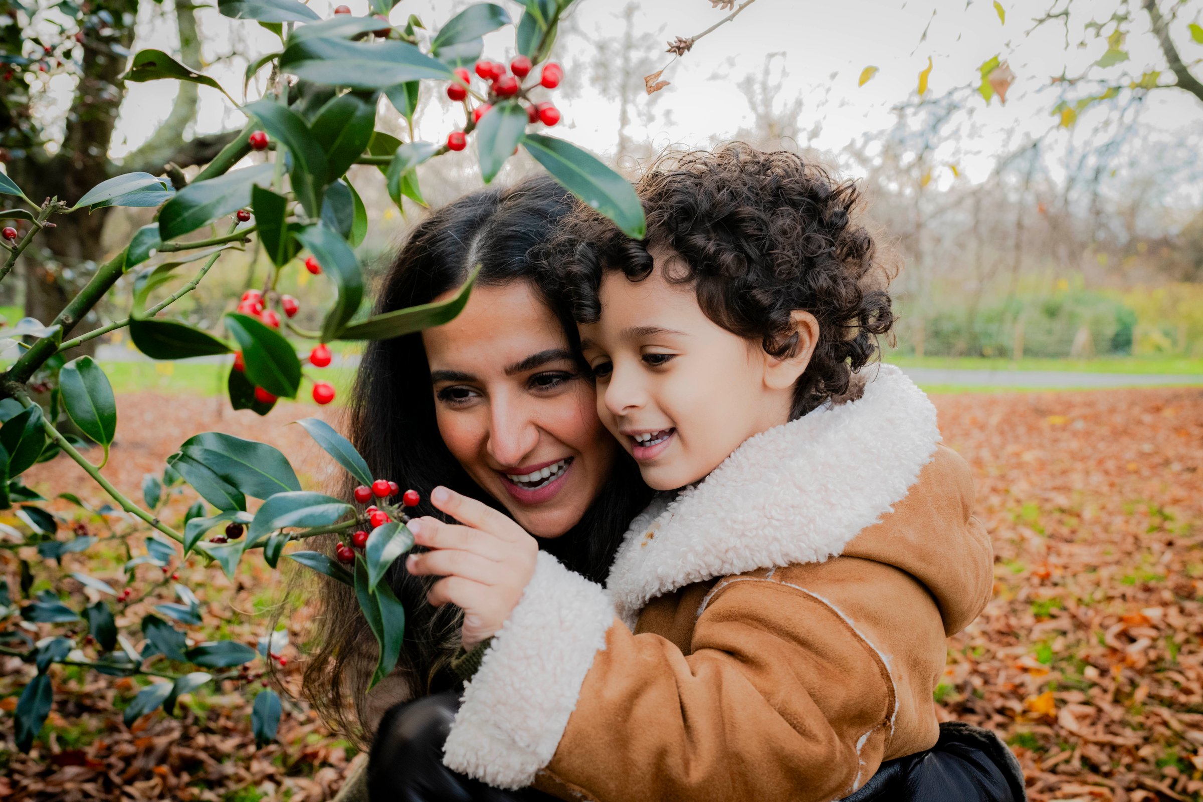 Family playing in a London park during a photoshoot